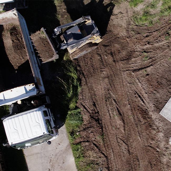 Neowaste vehicles removing construction waste